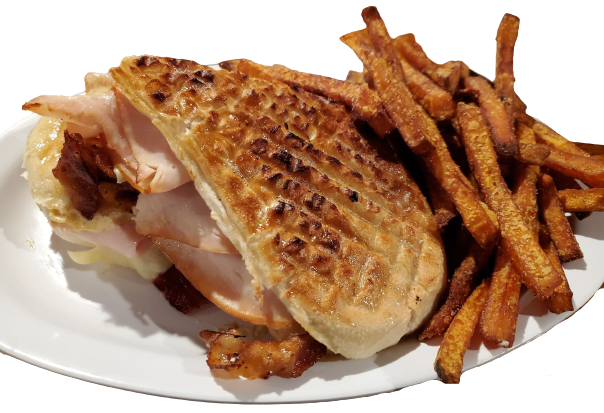 raditional Cuban Sandwich... Turkey, Ham, Bacon, Swiss Cheese, Pickles, Cuban sauce, served with sweet potato fries