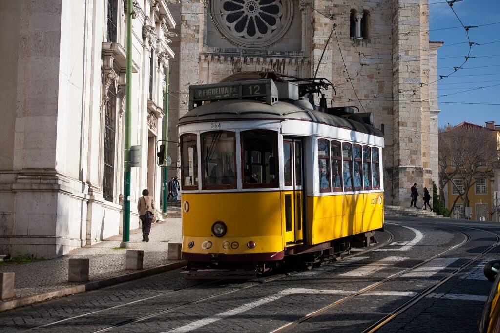 A Lisbon tram by Lisbon Cathedral and Santo António Church