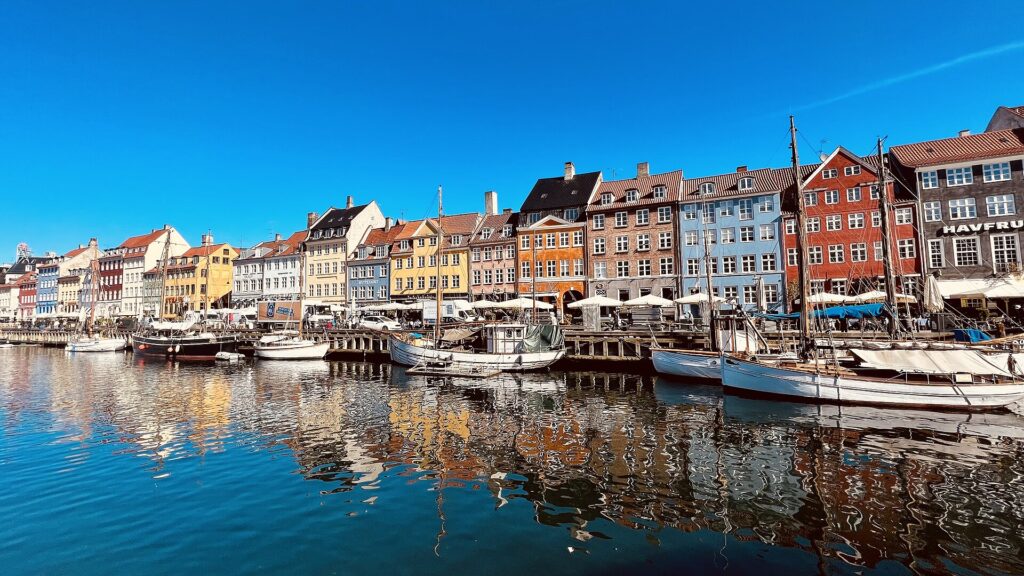 Nyhavn Colorful facade and old ships along the Nyhavn Canal